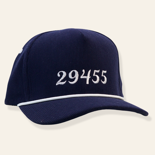 Navy corduroy baseball cap featuring embroidered “29455” with contrast piping. Classic, subtle, and perfect for everyday wear or gifting.
