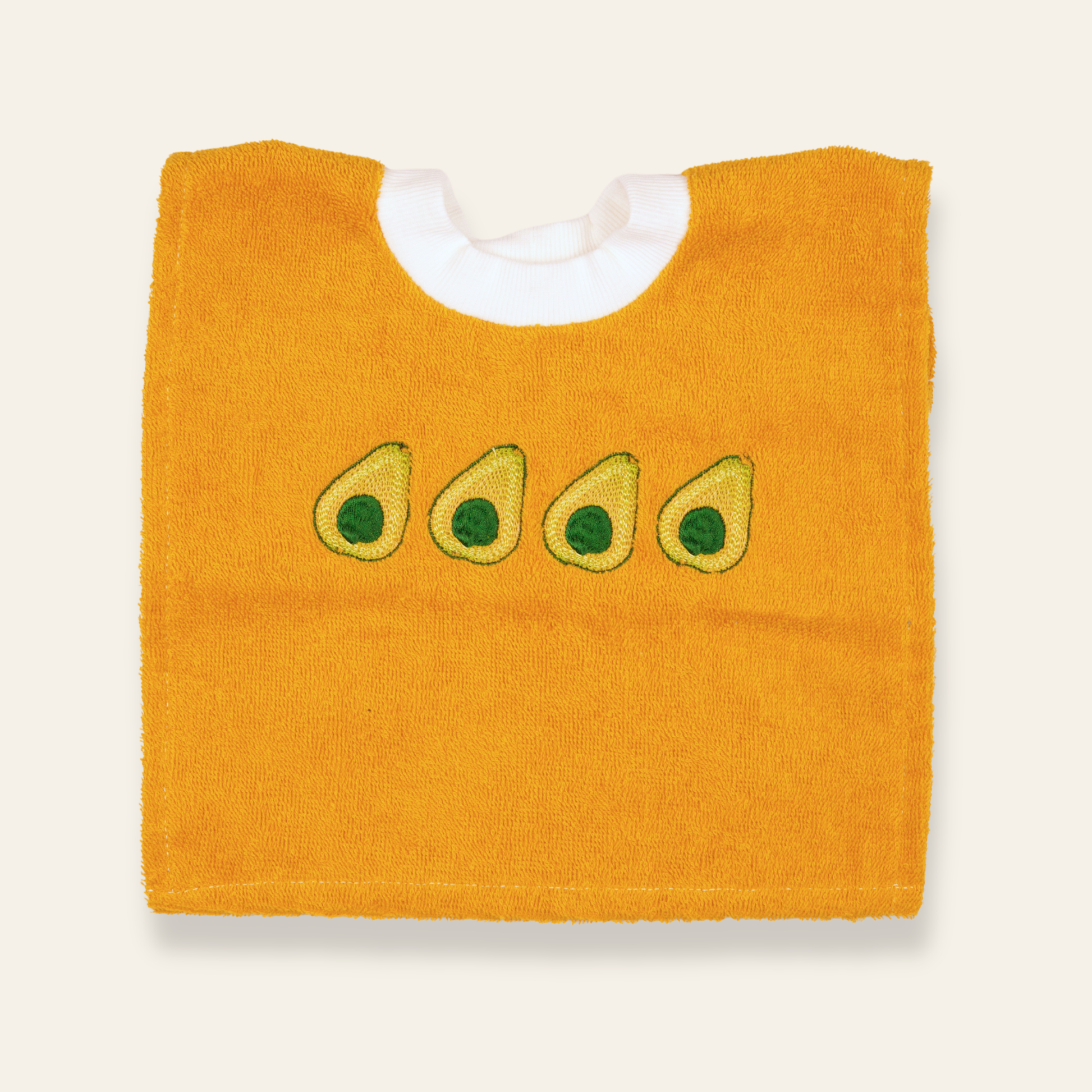 Soft yellow baby bib featuring embroidered avocados. Absorbent, playful, and perfect for everyday meals or gifting.
