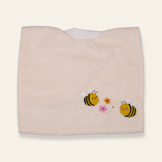 Soft baby bib featuring embroidered bees and flowers. Absorbent, neutral, and perfect for everyday meals or gifting.
