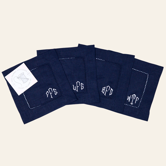 Navy embroidered cocktail napkins with classic hemstitch detailing and playful abbreviation embroidery. Set of 4, perfect for entertaining and gifting.