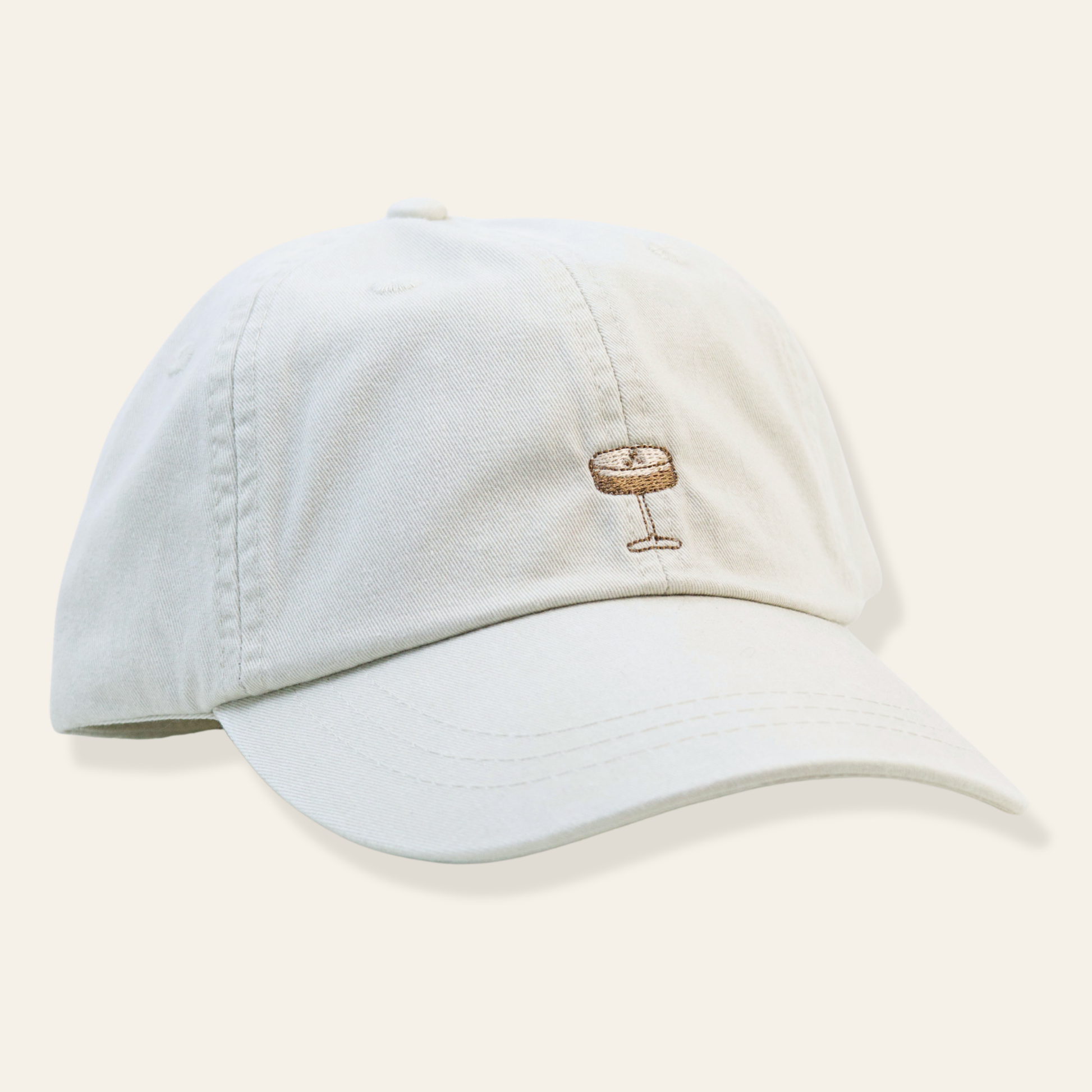 Neutral baseball cap featuring a minimal embroidered espresso martini. Casual, stylish, and perfect for cocktail lovers and everyday wear.