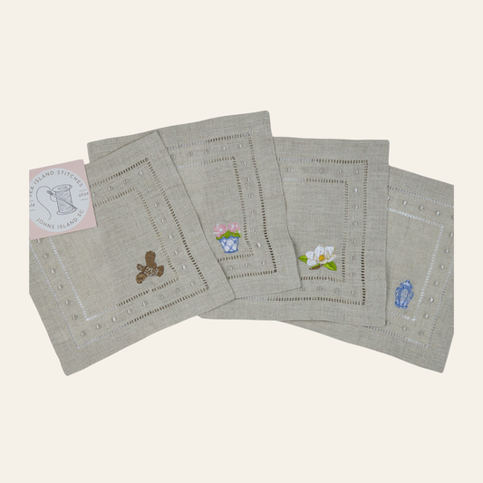 Elegant embroidered linen cocktail napkins with classic hemstitch detailing. Set of 4, perfect for entertaining, hostess gifts, and timeless table décor.