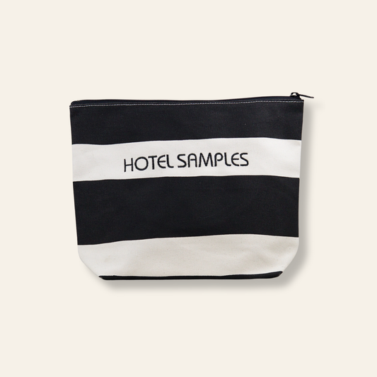 A funny embroidered canvas pouch labeled “Hotel Samples.” Perfect for travel toiletries, organization, and gifting.