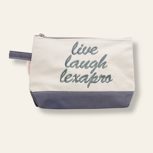 A funny embroidered canvas pouch featuring “Live Laugh Lexapro.” Perfect for makeup, meds, travel essentials, and gifting. Shop now at Sea Island Stitches.