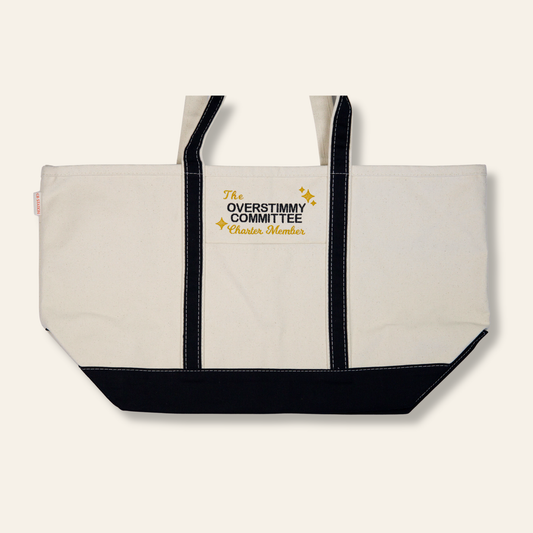 Funny embroidered canvas tote bag that reads “The Overstimmy Committee – Charter Member.” A relatable, sturdy everyday tote with black trim — perfect for errands, work, or gifting.