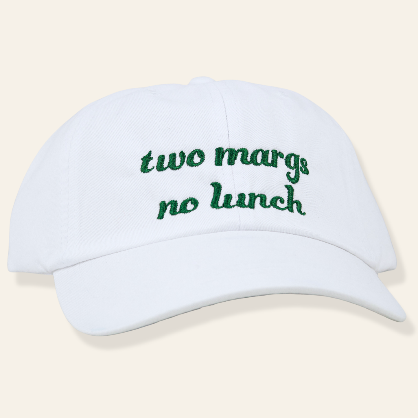 White embroidered cap featuring “two margs, no lunch.” Soft cotton, adjustable fit, and a fun everyday accessory perfect for gifting.